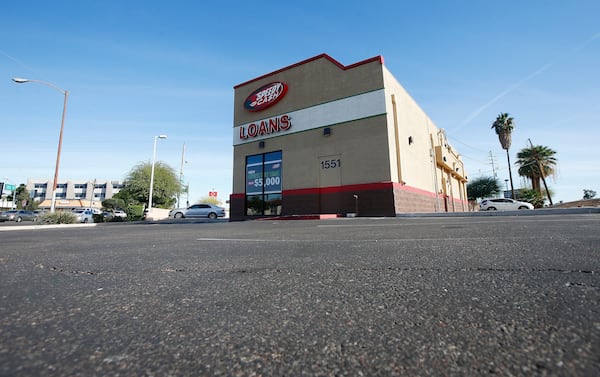 FILE - A sparse parking lot is seen Jan. 18, 2018, in Phoenix, where police say a double homicide previously took place that is linked to Cleophus Cooksey. The double homicide at the location took place on Monday, Nov. 27, 2017. (AP Photo/Ross D. Franklin, File)