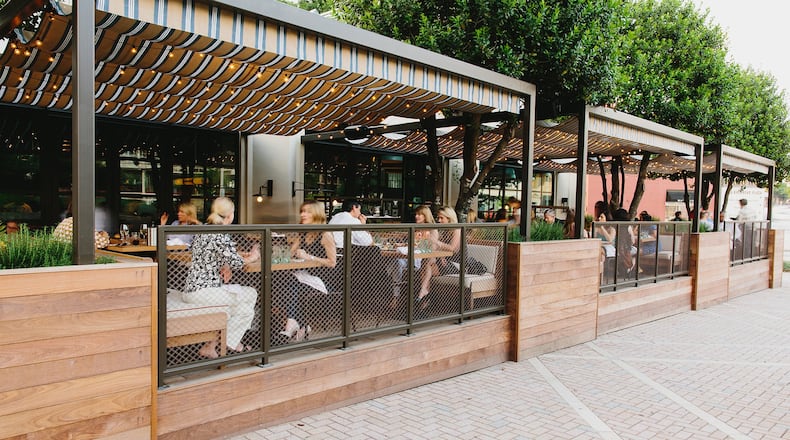 King + Duke has a well-appointed patio that overlooks one of Buckhead’s busiest intersections. CONTRIBUTED BY ANDREW THOMAS LEE