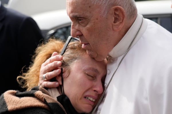 FILE - Pope Francis consoles Serena Subania who lost her daughter Angelica, 5 years old, the day before, as he leaves the Agostino Gemelli University Hospital in Rome, Saturday, April 1, 2023 after receiving treatment for a bronchitis. (AP Photo/Gregorio Borgia, File)