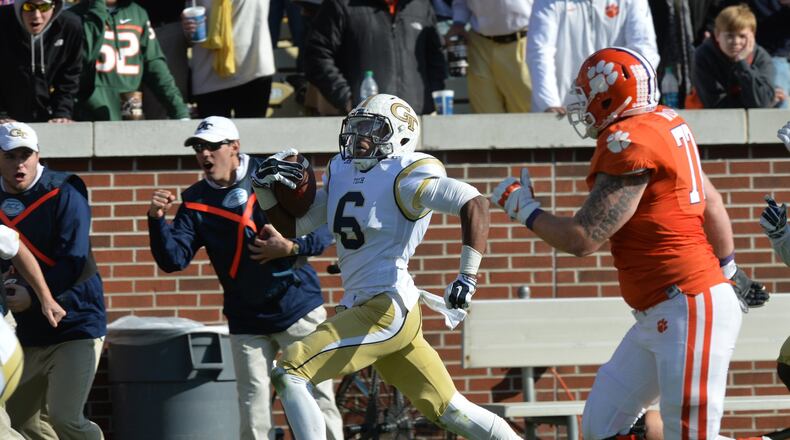 Georgia Tech defensive back Chris Milton (6) runs for a touchdown after he intercepted a pass in the Yellow Jackets’ 28-6 victory against Clemson on Saturday. HYOSUB SHIN / HSHIN@AJC.COM