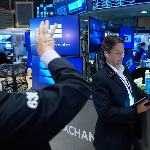 Patrick McKeon works on the floor at the New York Stock Exchange in New York, Monday, July 6, 2026. (AP Photo/Seth Wenig)
