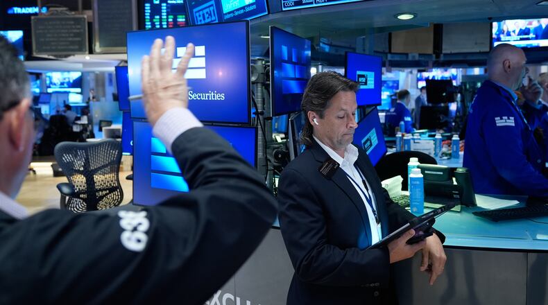 Patrick McKeon works on the floor at the New York Stock Exchange in New York, Monday, July 6, 2026. (AP Photo/Seth Wenig)
