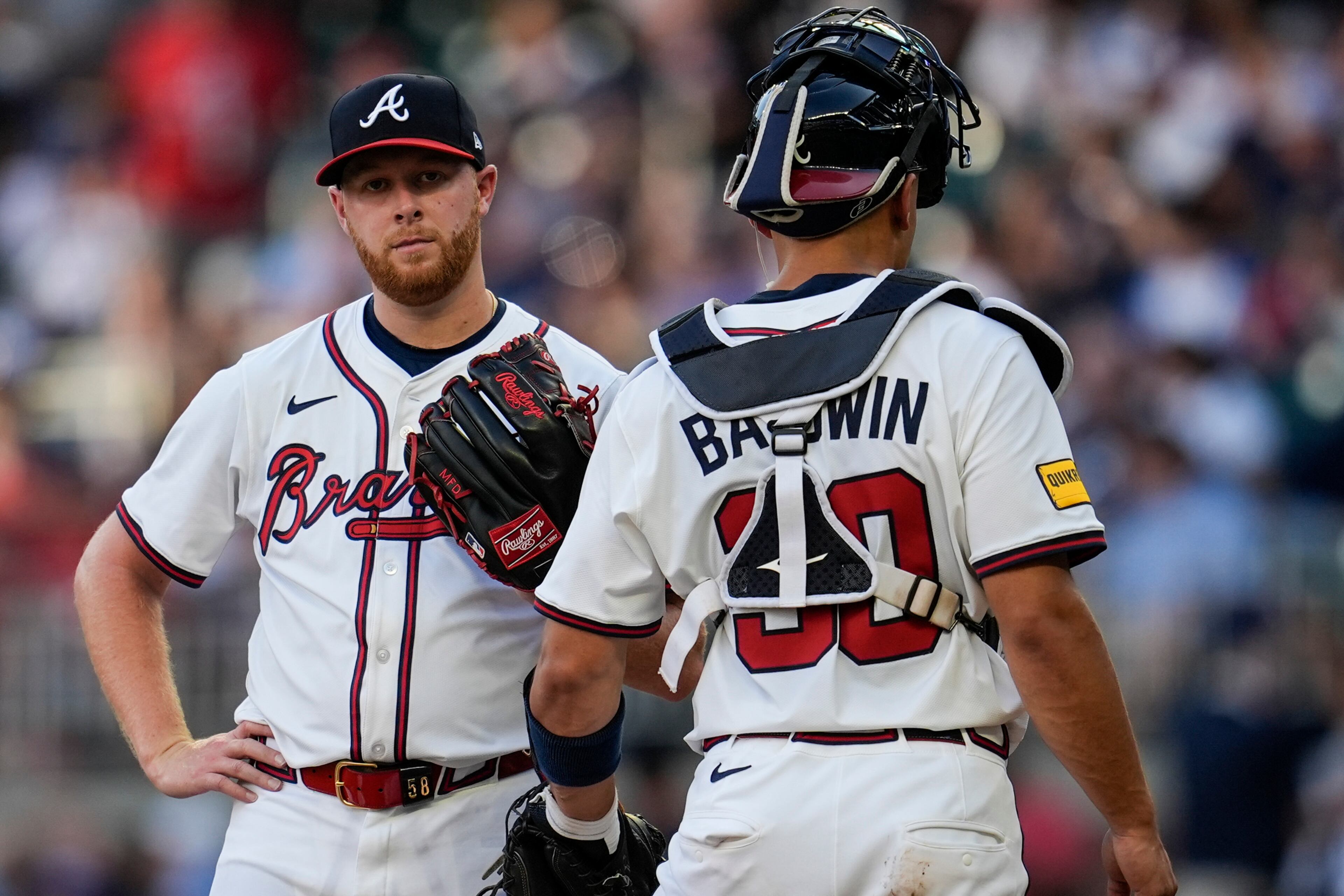 Atlanta Braves pitcher Davis Daniel speaks with catcher Drake Baldwin in the second inning of a baseball game against the San Francisco Giants, Tuesday, July 22, 2025, in Atlanta. (Mike Stewart/AP)