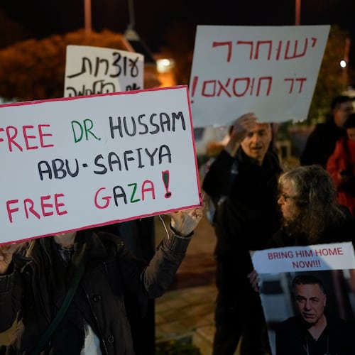 FILE - A woman holds a sign that reads "Free Dr. Hussam Abu Safiya, Free Gaza" during a protest in front of the Shin Bet offices, calling for his release, in Tel Aviv, Israel, on Jan. 1, 2025. (AP Photo/Matias Delacroix, File)
