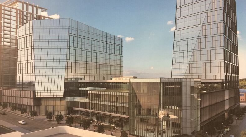 This rendering shows the two phases of Spring and 8th Street, the headquarters campus of NCR. The first tower, a 20-story office building to the right, is under construction. The smaller tower to the left is being designed. Source: Cousins Properties, NCR, Duda Paine Architects, HKS and Kimley-Horn