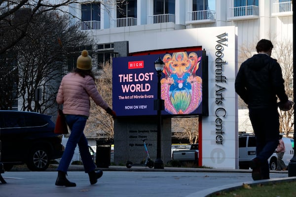 Pedestrians walk by the Woodruff Arts Center — home to the High Museum of Art, the Alliance Theater and the Atlanta Symphony Orchestra — in Midtown on Thursday, Dec. 11, 2025. (Miguel Martinez/AJC)