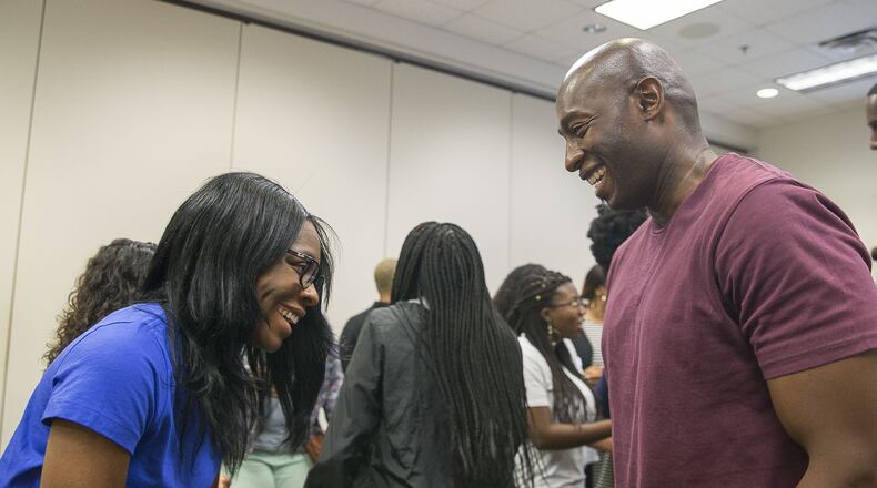 Lake City Elementary School physical education teacher Christopher Alexander (right) introduces himself to Forest Park High School teacher Sherena Knowlton (left) during the Clayton County Public Schools’ new teacher professional learning program at the Clayton County Public Schools Professional Learning Center in Jonesboro, Wednesday, July 24, 2019. (Alyssa Pointer/alyssa.pointer@ajc.com)