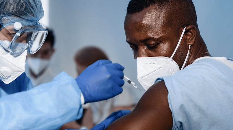 The Prevention Research Center (PRC) at Georgia State University has received a one-year, $500,000 grant from the Centers for Disease Control and Prevention (CDC) to identify behaviors and solutions to increase COVID-19 vaccine confidence and uptake in the African American and refugee, immigrant and migrant (RIM) community in Clarkston, Ga.
Clarkston, in DeKalb County, is one of the largest refugee resettlement communities in the country, with thousands of refugees having resettled there and in surrounding communities over the past two decades.
The project aims to train and deploy “community navigators” representing the various cultural groups living in Clarkston, including the Burmese, Congolese, Afghan, Somali, Middle East and African American communities. The navigators will use a peer-to-peer, in-person approach with residents by conducting listening sessions to hear and address questions and concerns about the COVID-19 vaccine.