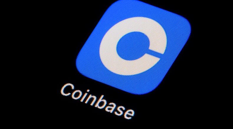FILE - The Coinbase app icon is seen on a smartphone, Feb. 28, 2023, in Marple Township, Pa. (AP Photo/Matt Slocum, File)