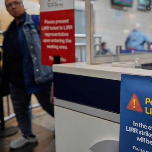 A sign warns commuters of a potential Long Island Rail Road strike at Penn Station in New York, Thursday, May 14, 2026. (AP Photo/Seth Wenig)
