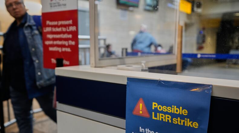 A sign warns commuters of a potential Long Island Rail Road strike at Penn Station in New York, Thursday, May 14, 2026. (AP Photo/Seth Wenig)