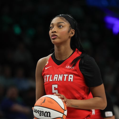 Atlanta Dream forward Angel Reese (5) looks on before a free throw during a WNBA basketball against the Minnesota Lynx, in Minneapolis, Saturday, May 9, 2026. (AP Photo/Bailey Hillesheim)