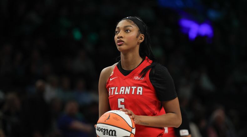 Atlanta Dream forward Angel Reese (5) looks on before a free throw during a WNBA basketball against the Minnesota Lynx, in Minneapolis, Saturday, May 9, 2026. (AP Photo/Bailey Hillesheim)