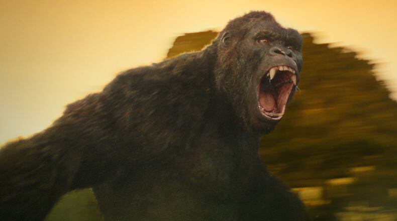 Kong protects the island against what he calls the “skullcrushers,” serpentine dragon-monsters that come up from the earth’s hollow core in”Kong: Skull Island.” (Warner Bros. Pictures via AP)