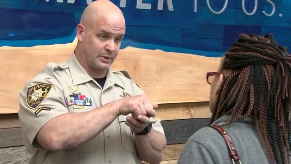 Master Deputy Don Black discusses firearm safety Saturday with a participant in the Responsible Firearms Carry and Safety class taught by the Gwinnett County Sheriff’s Office. Channel 2 Action News