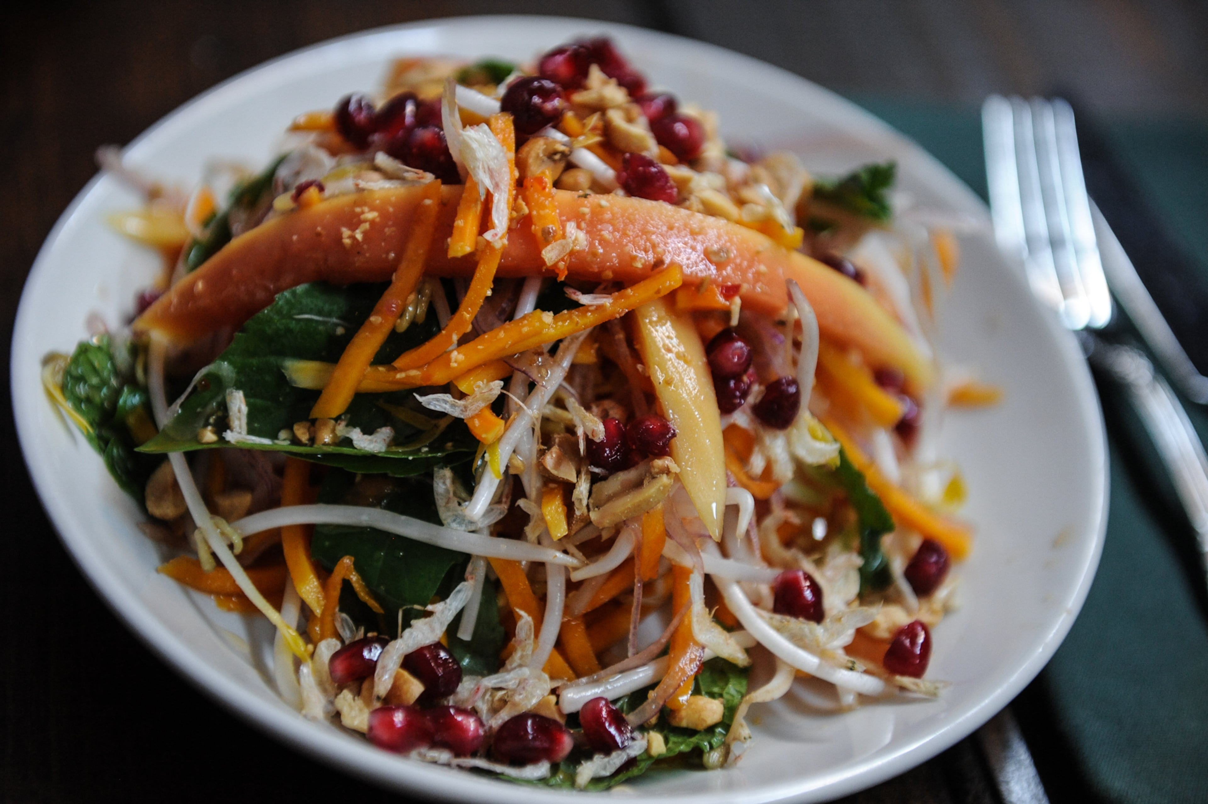Ticonderoga Club often finds inspiration in global flavors, like this southeast Asian-inflected salad featuring butternut squash, papaya and nuoc cham. (Becky Stein for the AJC)