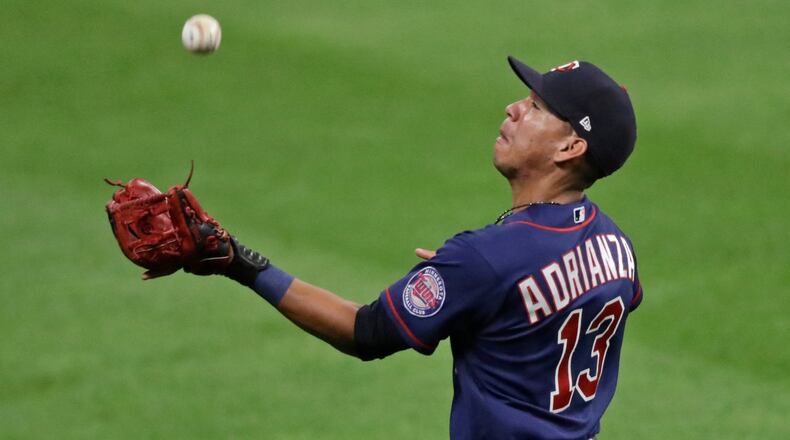 Minnesota Twins' Ehire Adrianza catches a fly ball in the seventh inning against the Cleveland Indians Wednesday, Aug. 26, 2020, in Cleveland. (Tony Dejak/AP)