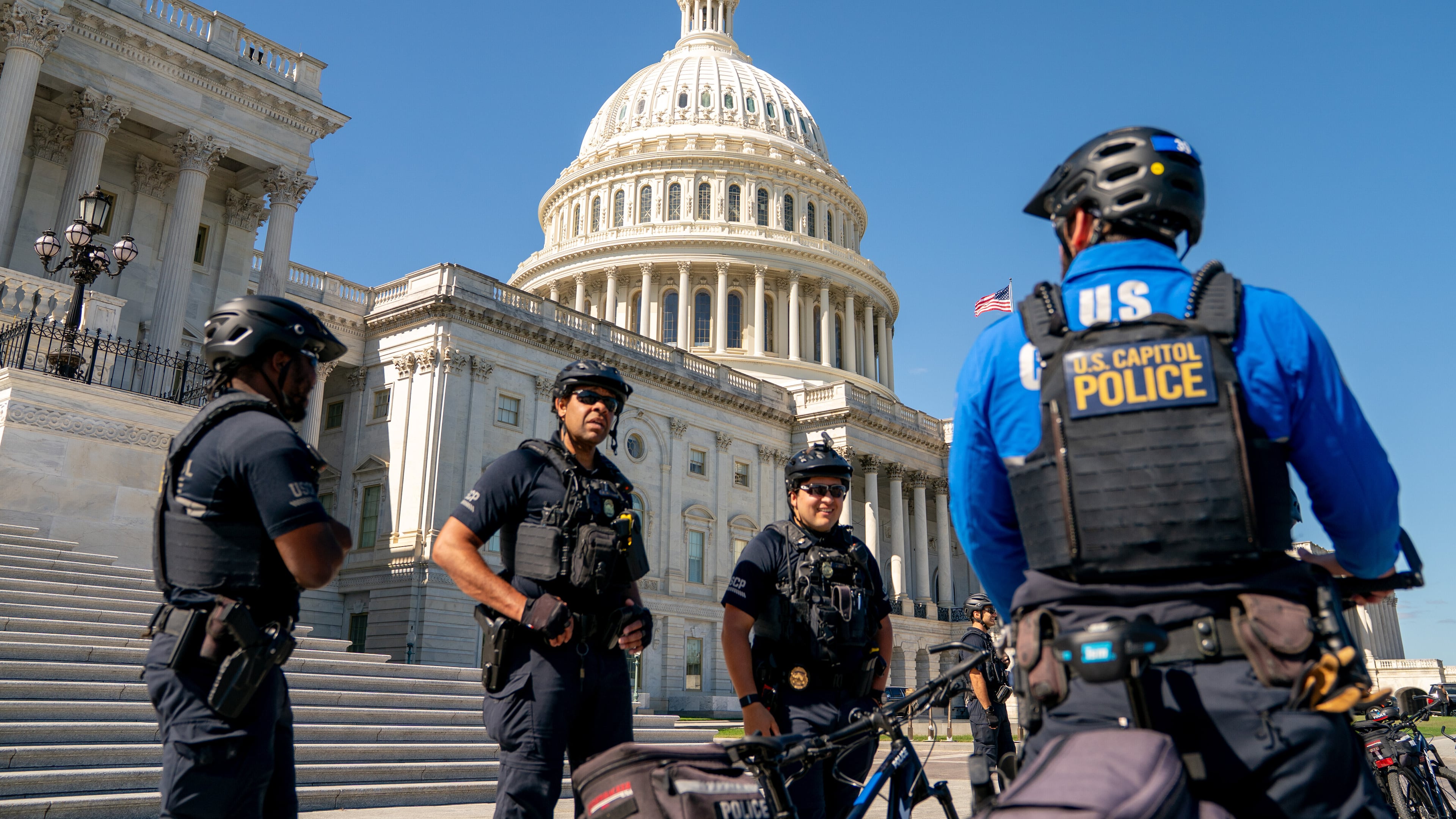 U.S. Capitol Police monitor the perimeter of the Capitol on the ninth day of the government shutdown, Thursday, Oct. 9, 2025 in Washington. (AP Photo/Allison Robbert)