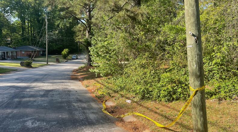 Crime scene tape is tied around a pole near the site where Lauren Bullis was killed, in Panthersville, Ga., Wednesday, April 15, 2026. (AP Photo/R.J. Rico)