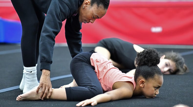 Gina White, owner of Phoenix Gymnastics, instructs her students at Hammond Park Gym. Sandy Springs terminated the rental agreement with the gymnastics vendor due to an outstanding payment balance. (Hyosub Shin / Hyosub.Shin@ajc.com)