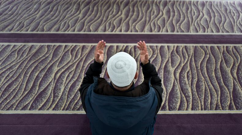 A Muslim man prays in a mosque in Amsterdam, Netherlands, (AP Photo/Muhammed Muheisen)