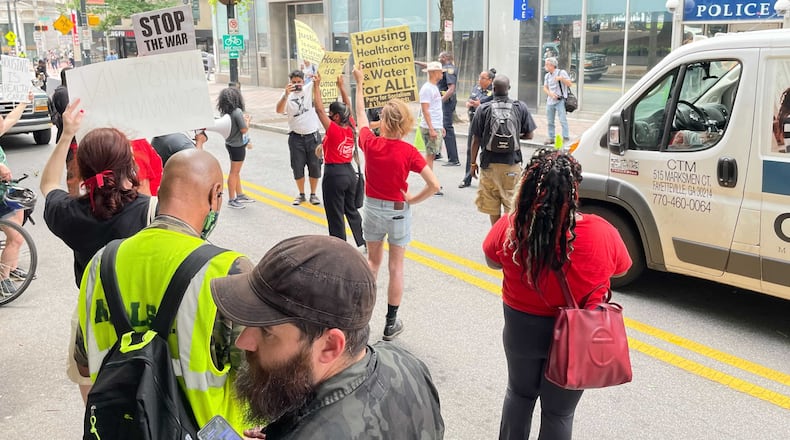 Activists gathered for a protest downtown Tuesday to urge the city to provide better services for its homeless population. (Anjali Huynh/AJC)
