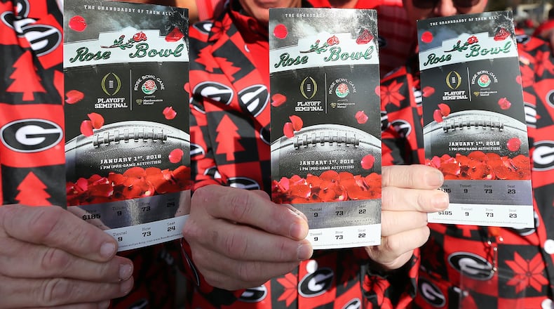 Georgia fans show off their tickets arriving for the College Football Playoff Semifinal at the Rose Bowl Game on Monday, January 1, 2018, in Pasadena. Curtis Compton/ccompton@ajc.com