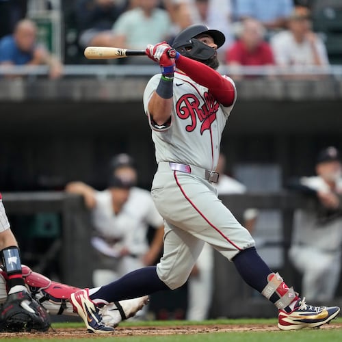 Philadelphia Phillies' Kyle Schwarber hits a home run during the fourth inning of a baseball game against the Minnesota Twins at the Field of Dreams movie site, Thursday, Aug. 13, 2026, in Dyersville, Iowa. (AP Photo/Charlie Neibergall)