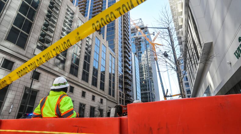 February 19, 2021 Atlanta: A crane working on 31-story office tower in Midtown malfunctioned in February and was in danger of falling. Google plans to move into the 410-foot building later this year. (John Spink / John.Spink@ajc.com)