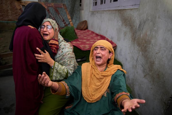 Relatives of Ahsan Ul Haq Shiekh, a militant who officials say is involved in the deadly attack on tourists in Pahalgam, wail after after Indian forces blew up the family home at Murran village in Pulwama, south of Srinagar, Indian controlled Kashmir, Saturday, April 26, 2025. (AP Photo/Dar Yasin)
