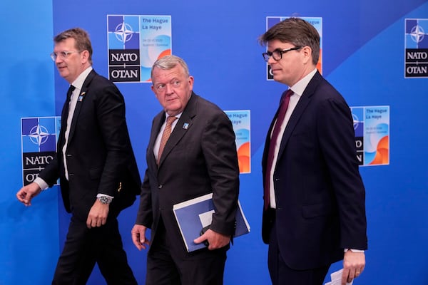 Denmark's Foreign Minister Lars Lokke Rasmussen, center, arrives for the NATO summit in The Hague, Netherlands, Wednesday, June 25, 2025. (AP Photo/Matthias Schrader)