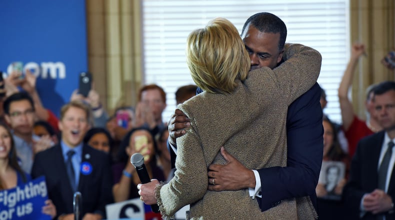 Hillary Clinton hugs Atlanta Mayor Kasim Reed in February 2016. HYOSUB SHIN / HSHIN@AJC.COM