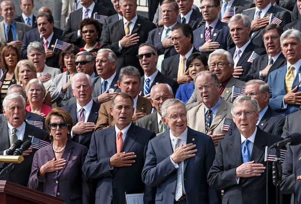 Members of Congress stand for the national anthem during a ceremony to remember the terror attacks of Sept.r 11, 2001, on the steps of the Capitol in Washington, Wednesday, Sept. 11, 2013. From left to right are House Minority Whip Steny Hoyer, D-Md., House Minority Leader Nancy Pelosi, D-Calif., Speaker of the House John Boehner, R-Ohio, Senate Majority Leader Harry Reid, D-Nev., and Senate Minority Leader Mitch McConnell, R-Ky.  (J. Scott Applewhite/AP)