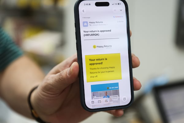 Happy Returns' SVP Joe McKinnie demonstrates a Happy Return at a UPS Store in Marietta, on Tuesday, April 21, 2026. (Abbey Cutrer/AJC)