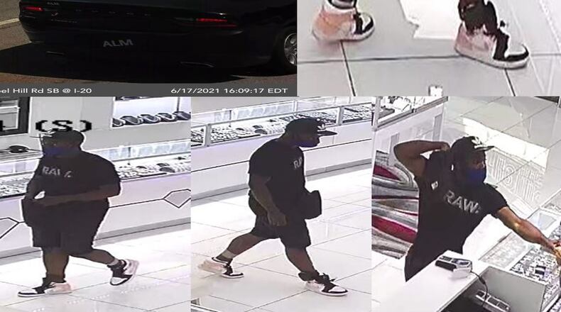 Douglasville police released photos of a man suspected of robbing the Ice Jewelry store at Arbor Place Mall at gunpoint.