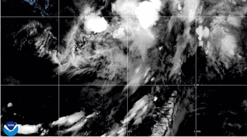 This NOAA satellite image taken at 11:04 a.m. EST on Thursday, Aug. 13, 2026, shows Tropical Storm Lala in the Pacific Ocean. (NOAA via AP)