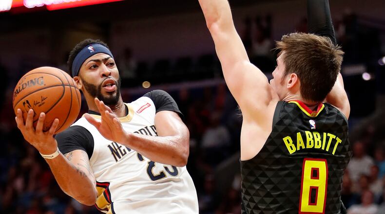 New Orleans Pelicans forward Anthony Davis (23) looks to shoot against Atlanta Hawks forward Luke Babbitt forward (8) during the first half of an NBA basketball game in New Orleans, Monday, Nov. 13, 2017. (AP Photo/Tyler Kaufman)