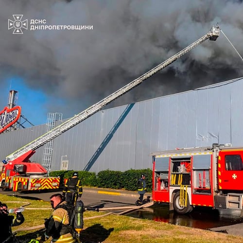 In this photo provided by the Ukrainian Emergency Service, firefighters work on a fire at a shopping mall following a Russian drone attack in Kryvyi Rih, Ukraine, Friday, Aug. 21, 2026. (Ukrainian Emergency Service via AP)