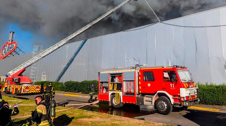 In this photo provided by the Ukrainian Emergency Service, firefighters work on a fire at a shopping mall following a Russian drone attack in Kryvyi Rih, Ukraine, Friday, Aug. 21, 2026. (Ukrainian Emergency Service via AP)