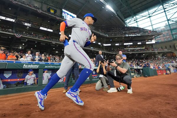 New York Mets' Juan Soto is introduced before an opening-day baseball game against the Houston Astros Thursday, March 27, 2025, in Houston. (AP Photo/David J. Phillip)