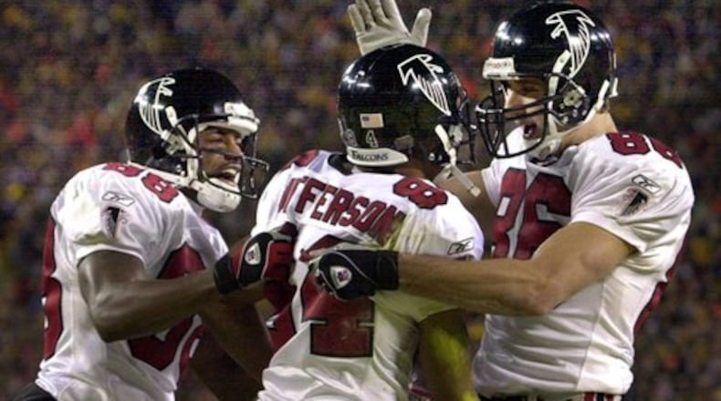 Falcons wide receivers (from left to right) Quentin McCord, Shawn Jefferson, and Brian Finneran celebrate Jefferson's touchdown catch - the first score of the game - that gave Atlanta an early lead that would quickly grow.