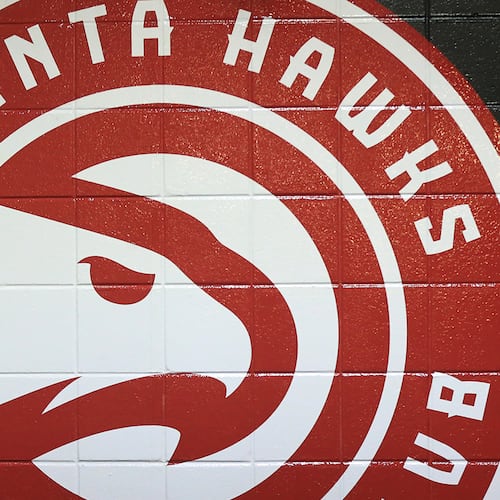 A Hawks logo painted on the tunnel wall leading out to the court on Tuesday, Oct. 27, 2015, in Atlanta. (Curtis Compton/AJC)