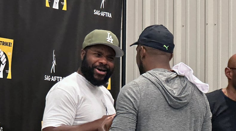 Atlanta-based actor Malcolm-Jamal Warner ("The Resident," "The Cosby Show") spoke at the end of a two-hour SAG-AFTRA rally in Atlanta Tuesday, August 22, 2023. RODNEY HO/rho@ajc.com