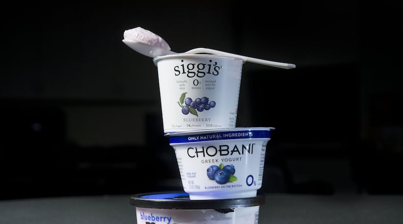 Three different yogurt products in studio in Sacramento on Thursday, Feb. 12, 2015. A recent study suggests yogurt could help lower risk of cardiovascular disease in adults who have high blood pressure. (Randall Benton/Sacramento Bee/TNS)