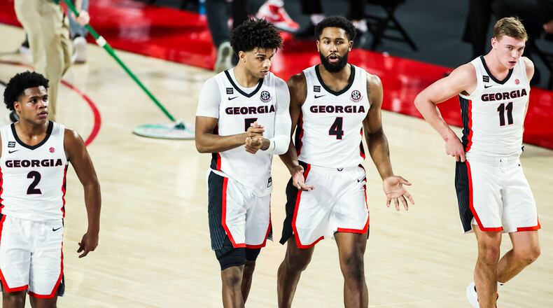 Georgia players Sahvir Wheeler (2), Justin Kier (5), Andrew Garcia (4) and Jaxon Etter  (11) take the floor to face Vanderbilt Saturday, Feb. 6, 2021, at Stegeman Coliseum in Athens. (Tony Walsh/UGA Sports)