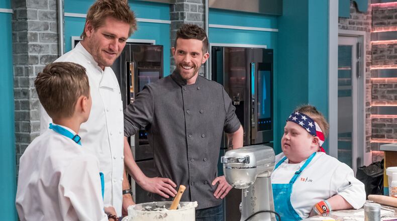TOP CHEF JUNIOR -- Episode 106 -- Pictured: (l-r) Head Judge Curtis Stone, Guest Chef Joshua John Russell, Fuller Goldsmith -- (Photo by: Dale Berman/Universal Kids)