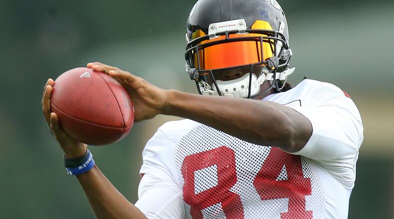Falcons veteran wide receiver Roddy White catches a pass during team practice. He will be out for a week or more, aiming to return for the season opener. (Curtis Compton/ccompton@ajc.com)