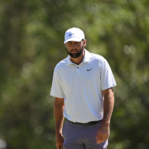 Scottie Scheffler lines up putt on third green during third round at the 2024 Masters Tournament at Augusta National Golf Club, Saturday, April 13, 2024, in Augusta, Ga. (Hyosub Shin/AJC)