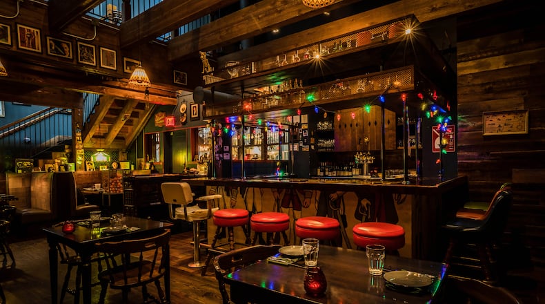 Crossing Ticonderoga Club’s threshold feels a bit like stepping into a different world from the bustle of Krog Street Market. (Courtesy of Brian Manley)