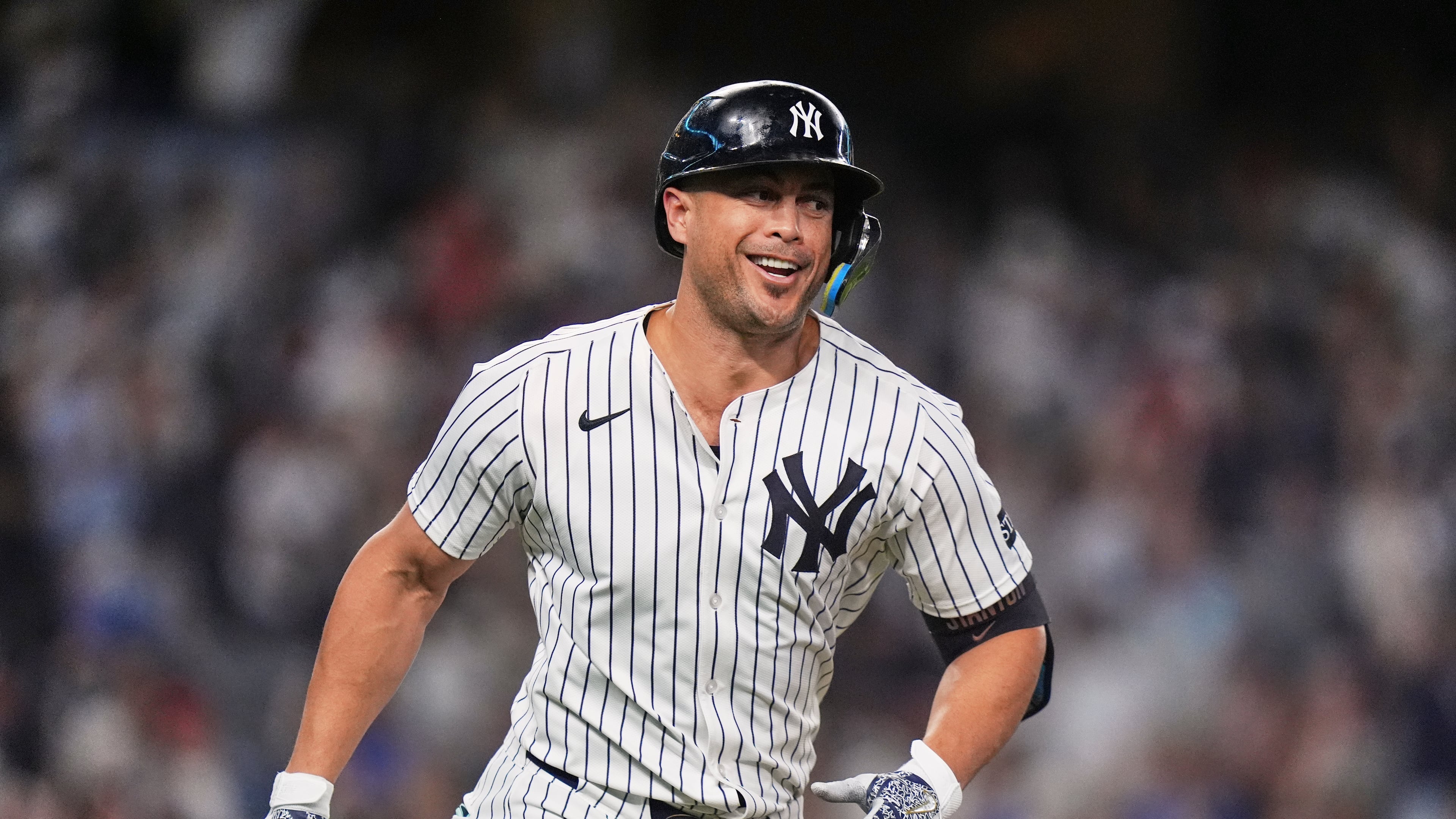 New York Yankees' Giancarlo Stanton smiles after hitting a two-run home run during the third inning of a baseball game against the Baltimore Orioles Friday, Sept. 26, 2025, in New York. (AP Photo/Frank Franklin II)